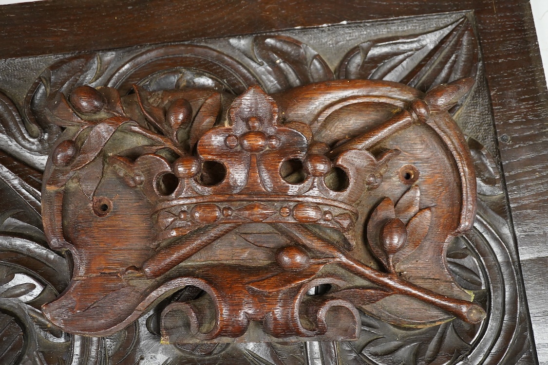 Three 18th century and later carved oak panels, one carved with a coronet, largest 46cm wide